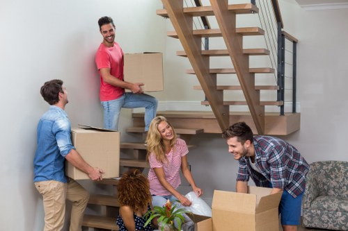 Removal van loading household items for a clear pricing example
