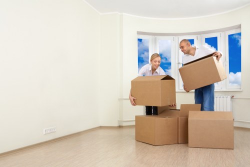 Office relocation setup with desks, boxes, and equipment in Thehyde