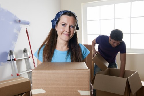 Professional movers handling packed household items