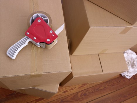 Professional movers loading household items for a Thehyde home removal