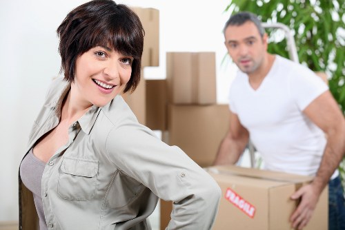 Preparing an office for relocation with labelled boxes and equipment