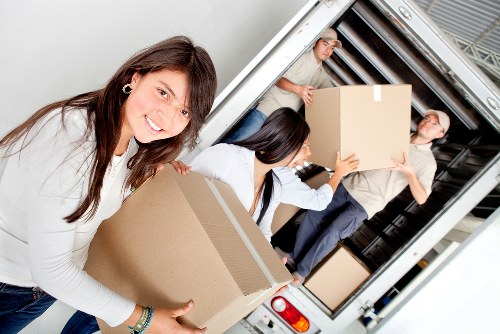 Local crew navigating stairs and access challenges for furniture pick-up in Thehyde