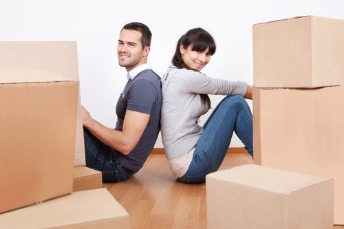 Worker moving boxes and household items for a Thehyde customer